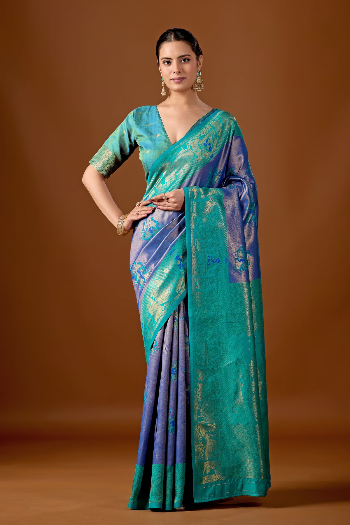 Woman in front pose wearing sea green indigo blue baarat motif zari pallu silk saree — Chandrikas