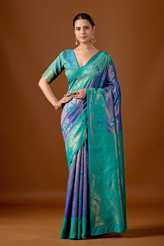 Woman in front pose wearing sea green indigo blue baarat motif zari pallu silk saree — Chandrikas
