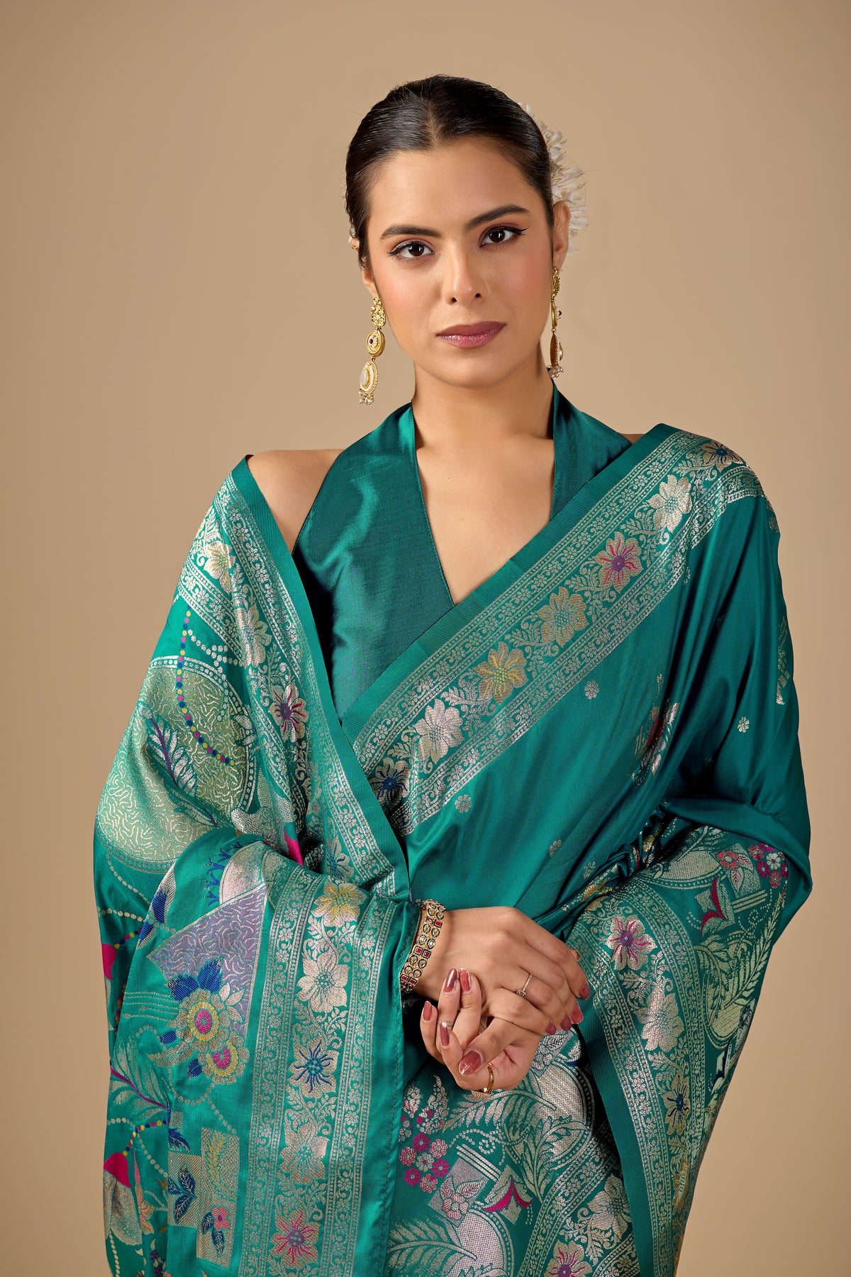 Woman in standing pose wearing sea green Meenakari deer motif zari pallu silk saree — Chandrikas