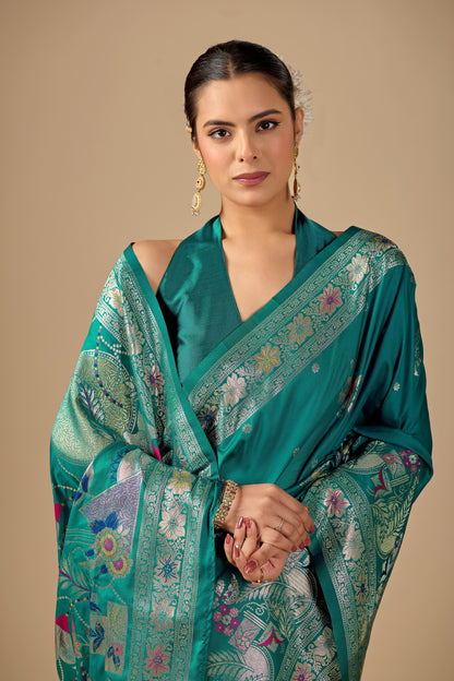 Woman in standing pose wearing sea green Meenakari deer motif zari pallu silk saree — Chandrikas