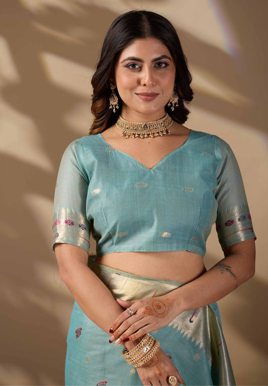 Woman in close pose wearing sky blue Banarasi-Paithani fusion cotton saree — Chandrikas