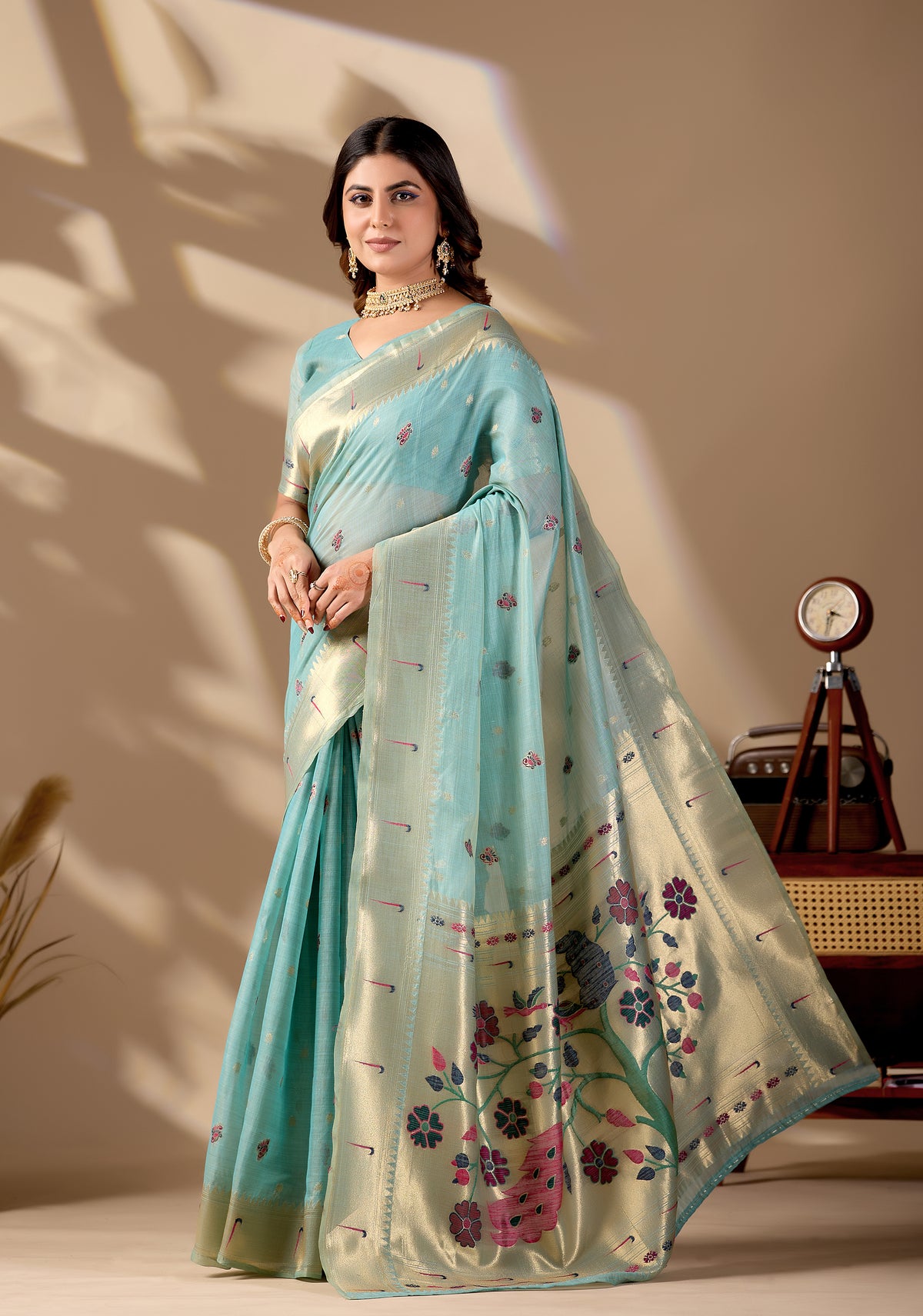 Woman in standing pose wearing sky blue Banarasi-Paithani fusion cotton saree — Chandrikas