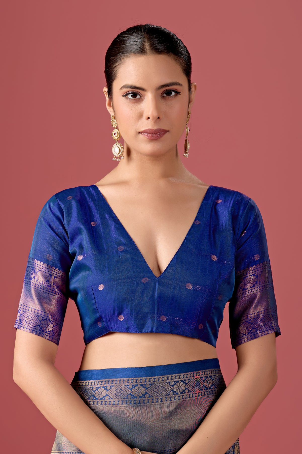 Woman in close pose wearing sky blue grey Banarasi silk checks pattern saree — Chandrikas