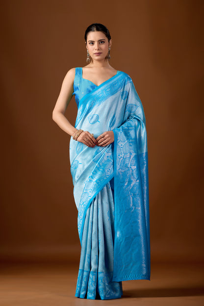Woman in front pose wearing sky blue leaf motif zari pallu silk saree — Chandrikas