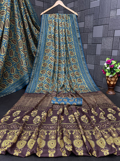 Teal blue leaf print cotton saree flatlay with brown border and matching blouse — Chandrikas
