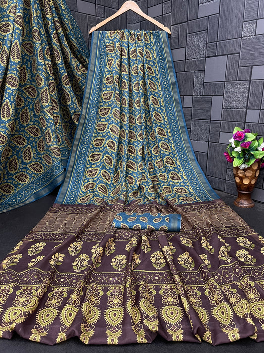 Teal blue leaf print cotton saree flatlay with brown border and matching blouse — Chandrikas