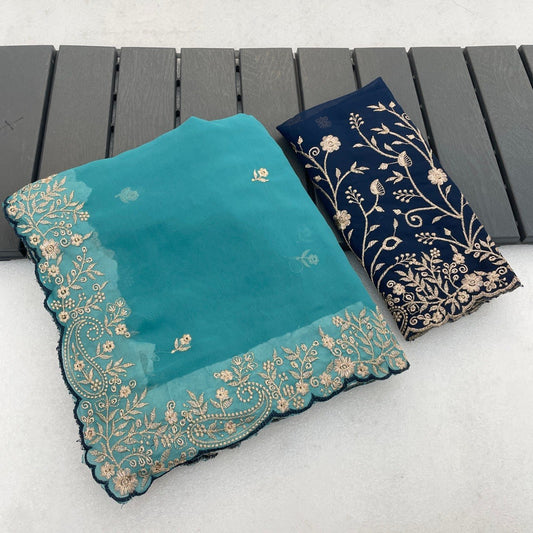 Turquoise teal Georgette saree flatlay with floral embroidered border and matching blouse — Chandrikas