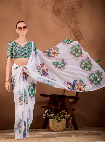 Model holding the pallu of White Bottle Green floral bird printed weightless saree to show floral and bird print — Chandrikas