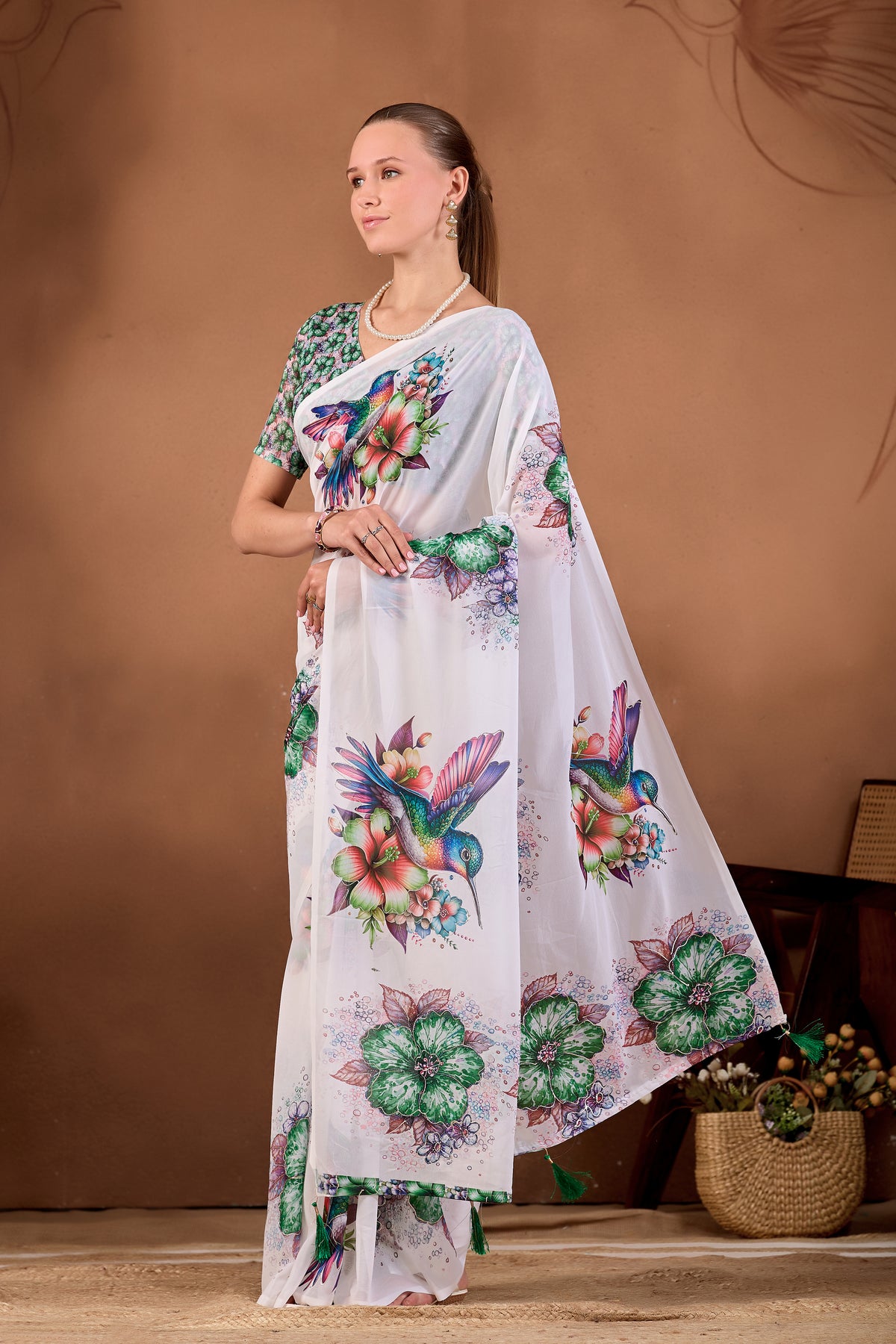 Side pose showing pleats and flowing drape of White Bottle Green floral bird printed weightless saree — Chandrikas
