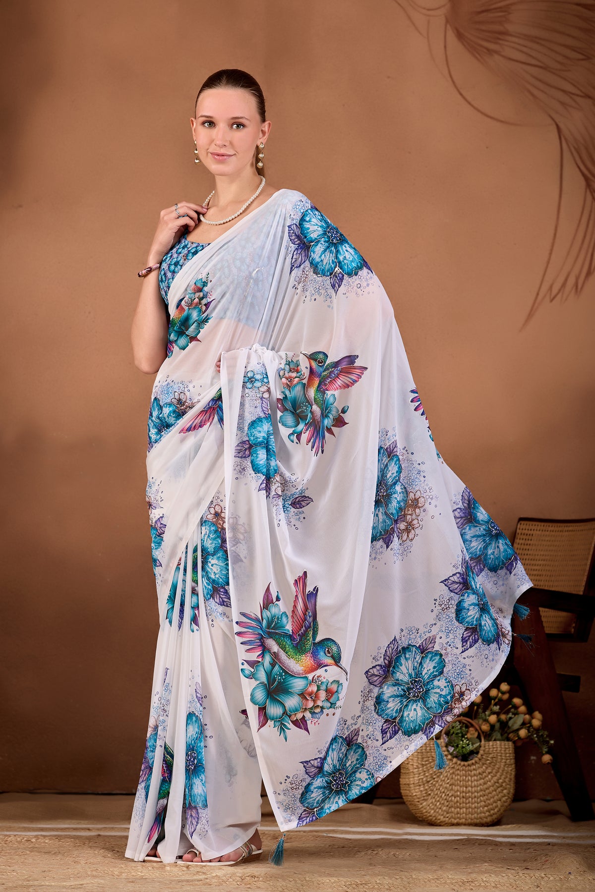 Side pose showing pleats and flowing drape of White Mor Peach floral bird printed weightless saree — Chandrikas
