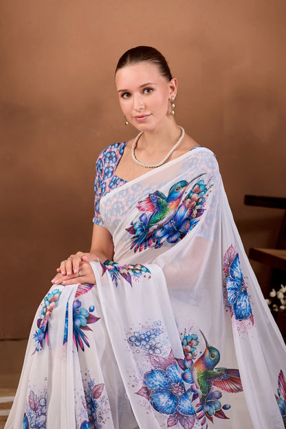 Seated close pose showing pallu and bird motif of White Navy Blue floral bird printed weightless saree — Chandrikas