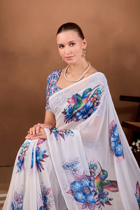 Seated close pose showing pallu and bird motif of White Navy Blue floral bird printed weightless saree — Chandrikas