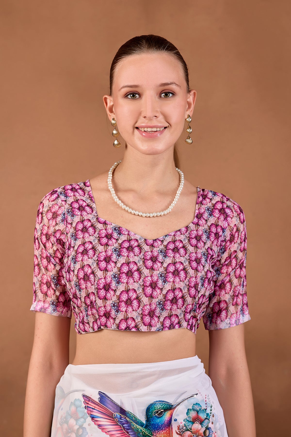 Model wearing White Wine floral bird printed weightless saree with matching pink printed blouse front view — Chandrikas