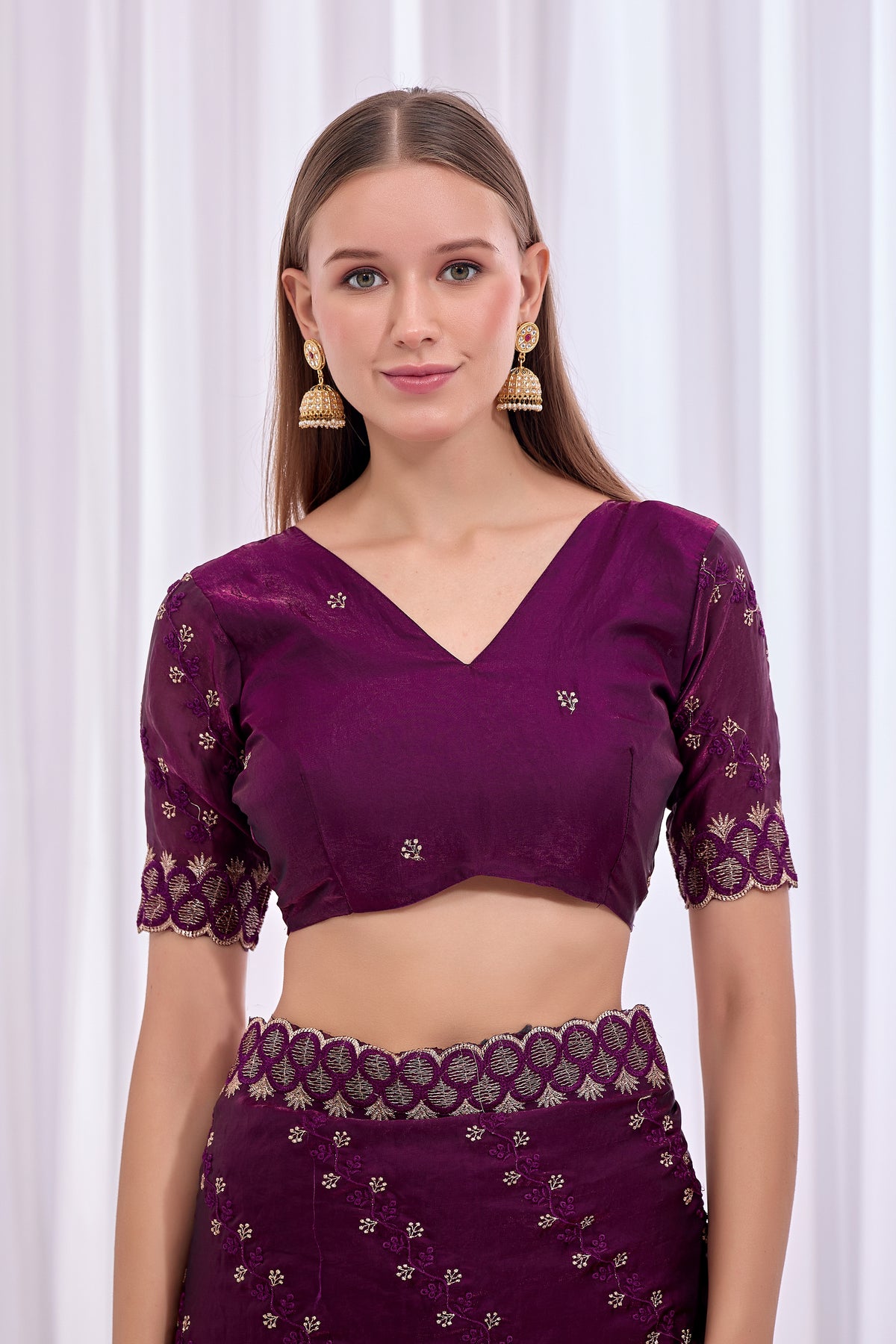 Model wearing Wine satin floral thread work designer border saree with embroidered blouse front view — Chandrikas