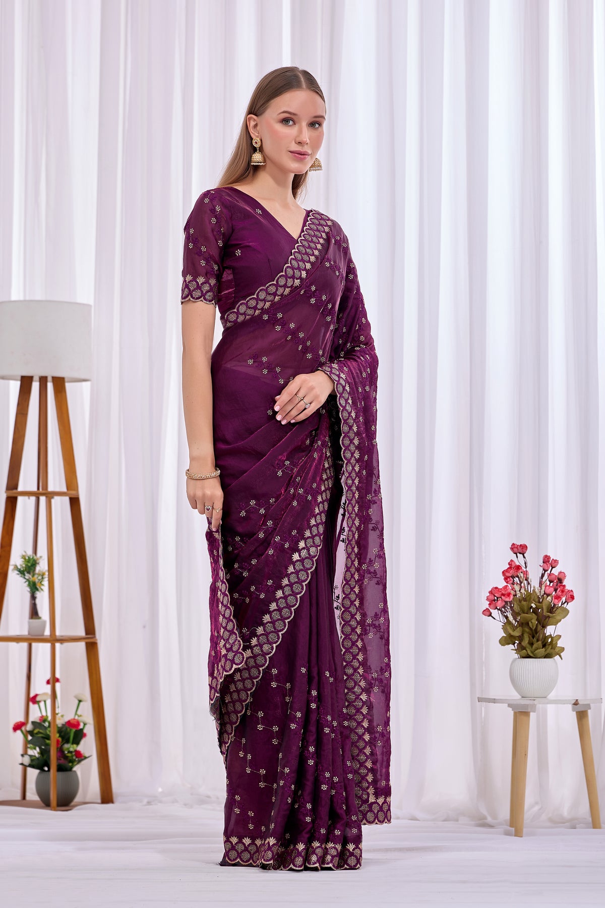 Side pose showing pleats and border of Wine satin floral thread work designer border saree — Chandrikas